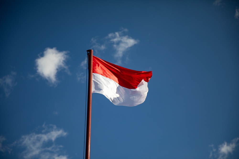 The flag of the Republic of Indonesia flies above Sekolah Dasar Negeri 2, during Super Garuda Shield 2024