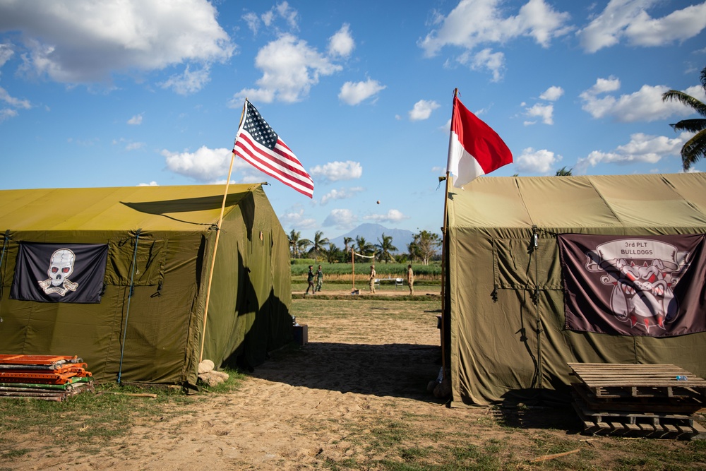 The flags of the United States of America and the Republic of Indonesia fly above Sekolah Dasar Negeri 2, during Super Garuda Shield 2024