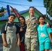 U.S. Army Sgt. 1st Class Kelly Carter, of the 610th Engineer Support Company, 864th Engineer Battalion, takes a picture with local children, Super Garuda Shield 2024