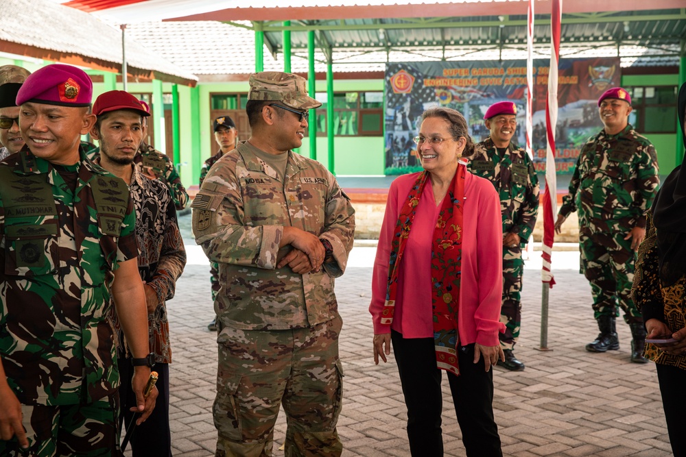 U.S. Ambassador to Indonesia, Kamala Shirin Lakhdhir (right), tours the newly renovated school in Palangan, Indonesia, during Super Garuda Shield