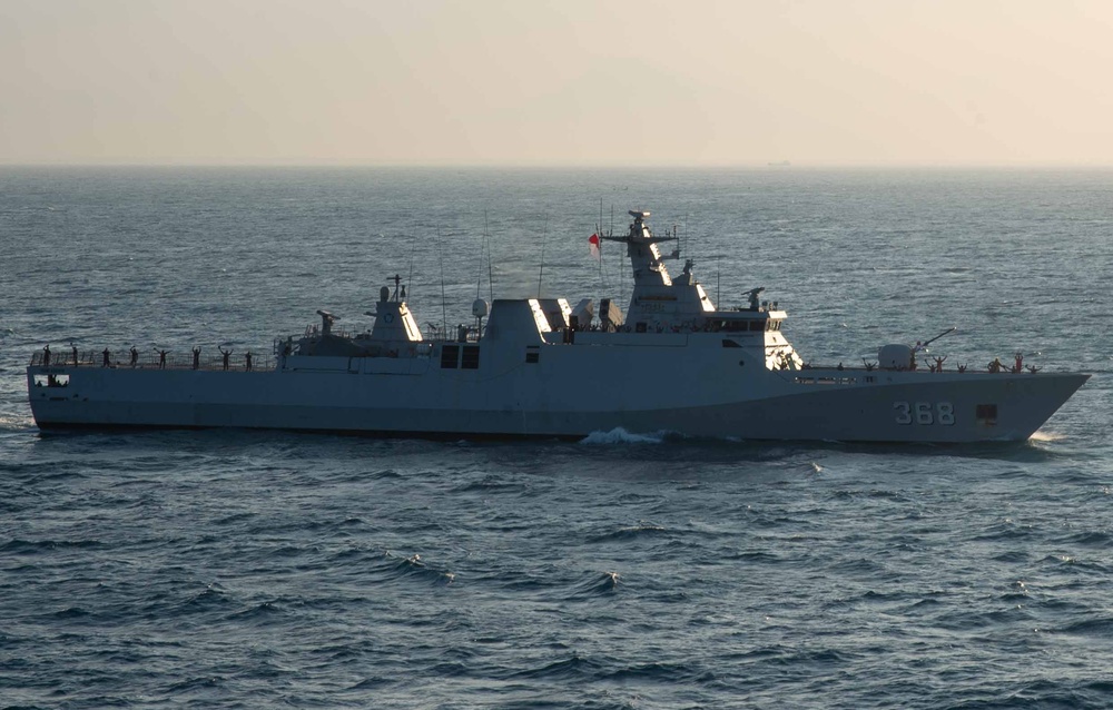 USS Green Bay participate in a Pass and Review Ceremony