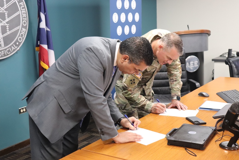 Brig. Gen. Daniel Hibner, Commander of the South Atlantic Division of the U.S. Army Corps of Engineers (USACE) and  Josué A. Colón Ortiz, Executive Director of the Puerto Rico Electric Power Authority (PREPA)sign a memorandum of understanding