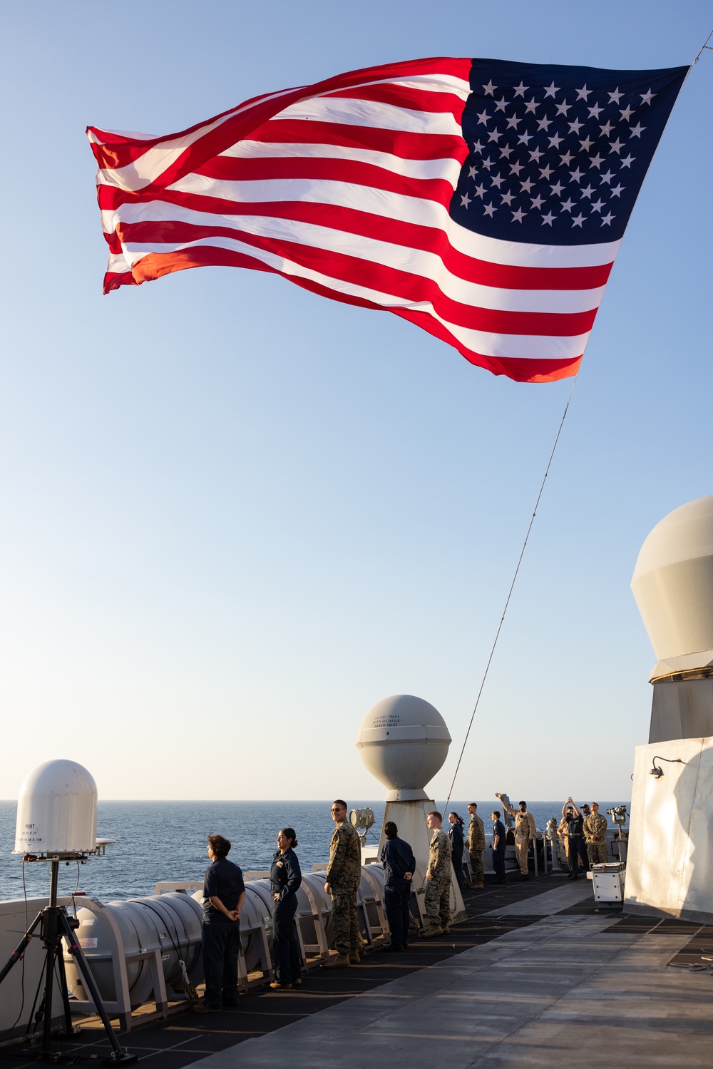 USS Green Bay conducts a Pass and Review while departing Super Garuda Shield 2024