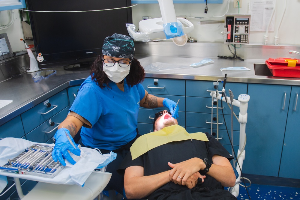 USS Ronald Reagan (CVN 76) Sailors conduct dental procedure