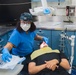 USS Ronald Reagan (CVN 76) Sailors conduct dental procedure