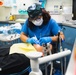USS Ronald Reagan (CVN 76) Sailors conduct dental procedure