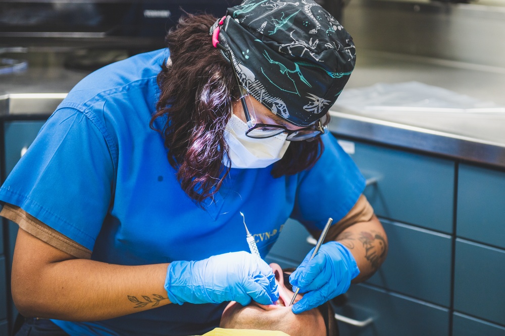 USS Ronald Reagan (CVN 76) Sailors conduct dental procedure