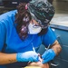 USS Ronald Reagan (CVN 76) Sailors conduct dental procedure