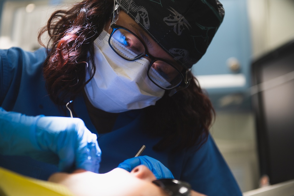 USS Ronald Reagan (CVN 76) Sailors conduct dental procedure
