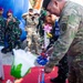 New Zealand Army Col. Paul Hayward, deputy commander of interoperability of the 25th Infantry Division, cuts the ribbon at the newly refurbished school in Palangan, Indonesia during Super Garuda Shield