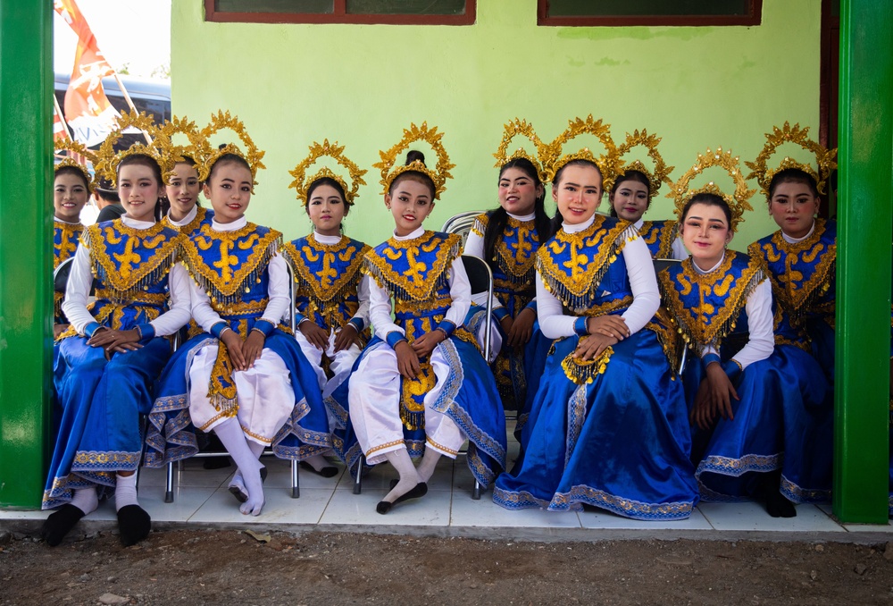 Children from Palangan, Indonesia prepare for their dance routine in celebration of their newly refurbished school during Super Garuda Shield