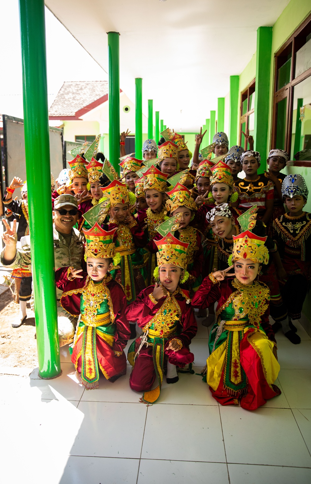 Children from Palangan, Indonesia prepare for their dance routine in celebration of their newly refurbished school during Super Garuda Shield, Sept. 5, 2024