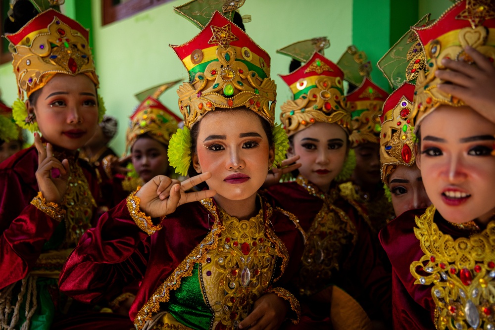 Children from Palangan, Indonesia prepare for their dance routine in celebration of their newly refurbished school during Super Garuda Shield