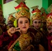 Children from Palangan, Indonesia prepare for their dance routine in celebration of their newly refurbished school during Super Garuda Shield