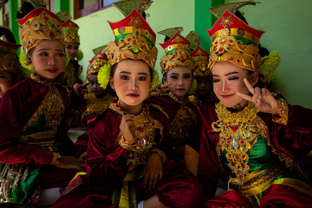 Children from Palangan, Indonesia prepare for their dance routine in celebration of their newly refurbished school during Super Garuda Shield