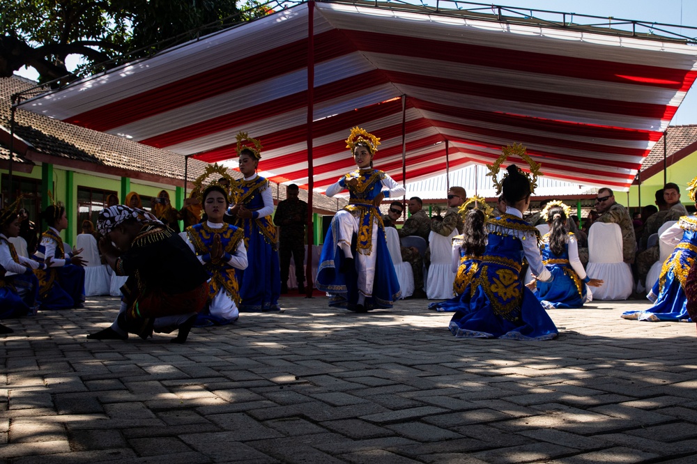 Children from Palangan, Indonesia perform their dance routine in celebration of their newly refurbished school during Super Garuda Shield