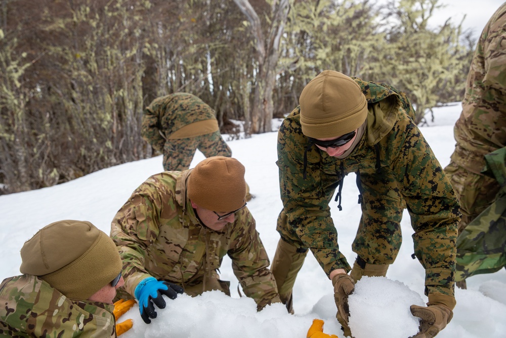 Chilean Marines teach cold-weather shelter building to U.S. Marines during UNITAS LXV