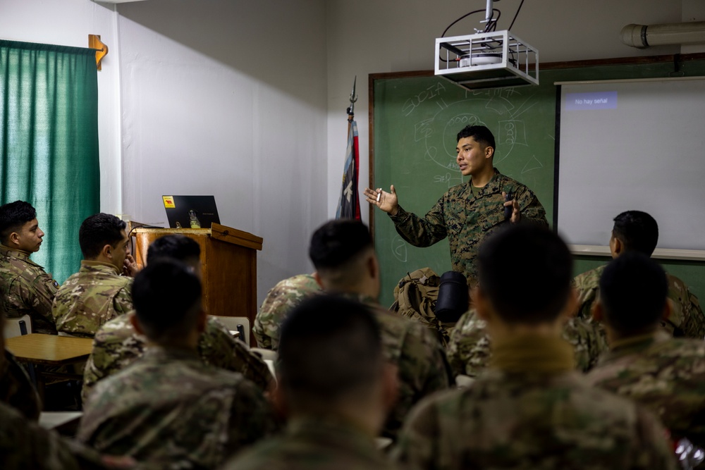 U.S. Marine Corps Mountain Warfare Instructors exchange knowledge with Argentine marines during pre-environmental training