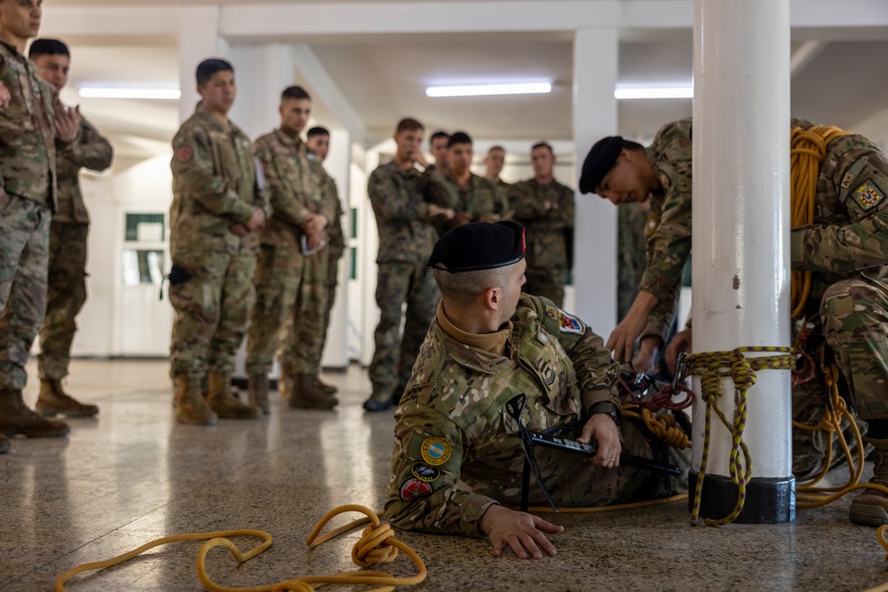 U.S. Marine Corps Mountain Warfare Instructors exchange knowledge with Argentine marines during pre-environmental training