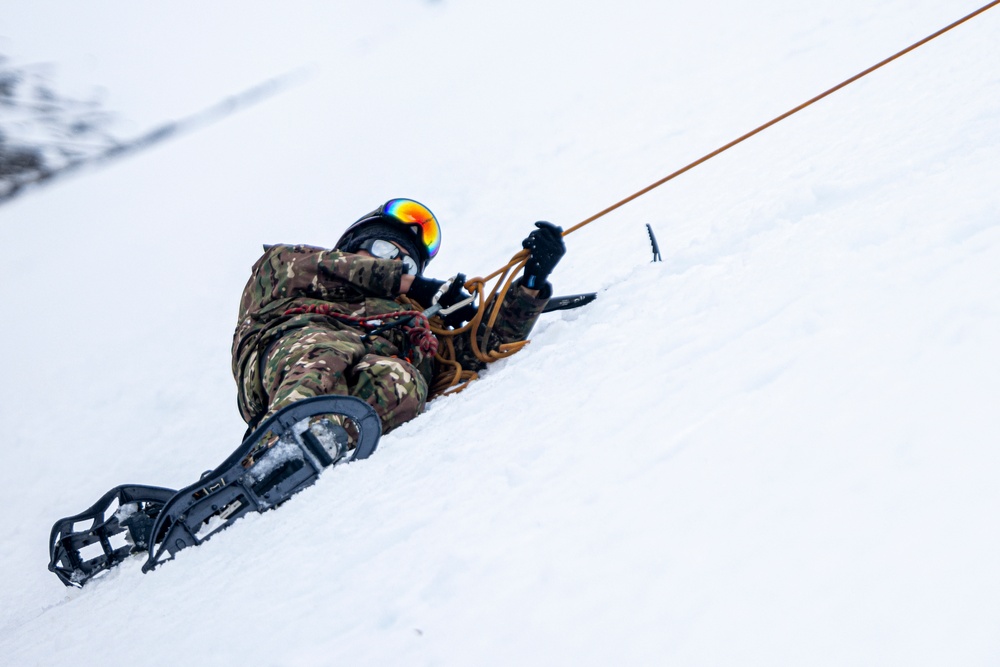 U.S. Marine Corps Mountain Warfare Instructors conduct cold-weather rescue training with Argentine marines