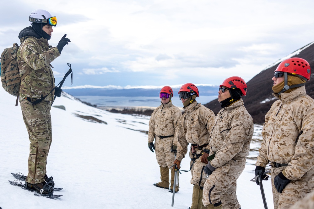 U.S. Marine Corps Mountain Warfare Instructors conduct cold-weather rescue training with Argentine marines