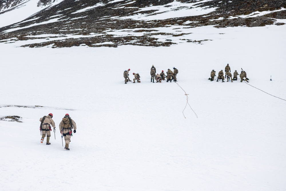 U.S. Marine Corps Mountain Warfare Instructors conduct cold-weather rescue training with Argentine marines