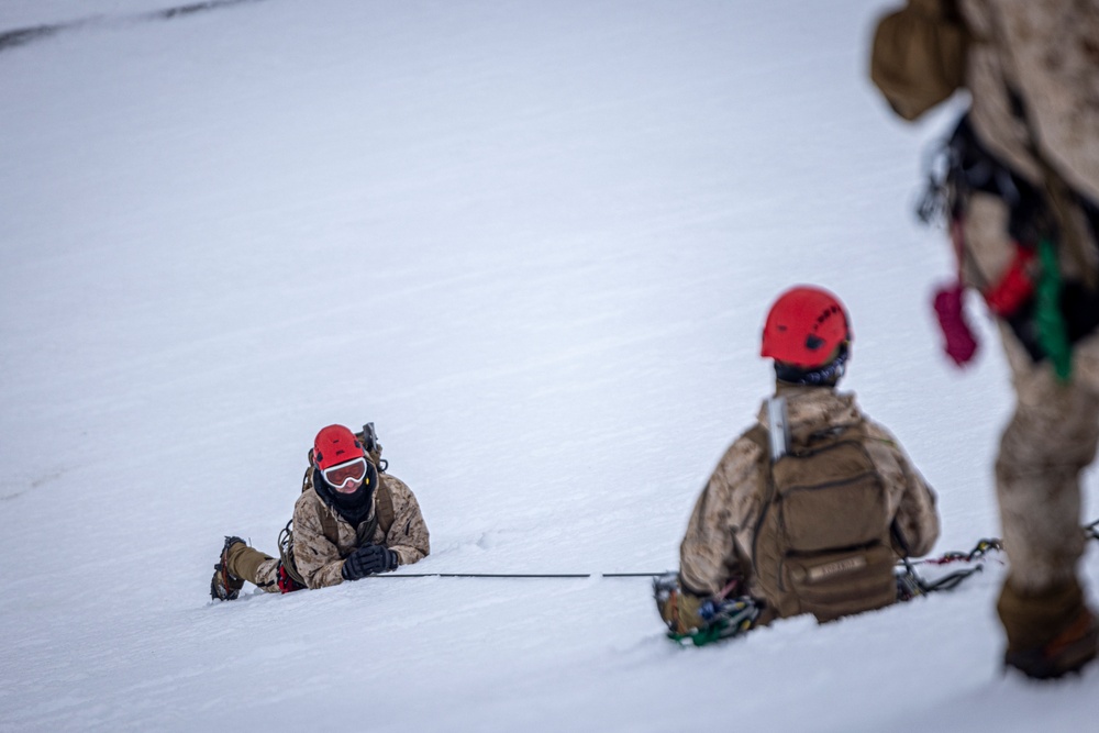 U.S. Marine Corps Mountain Warfare Instructors conduct cold-weather rescue training with Argentine marines