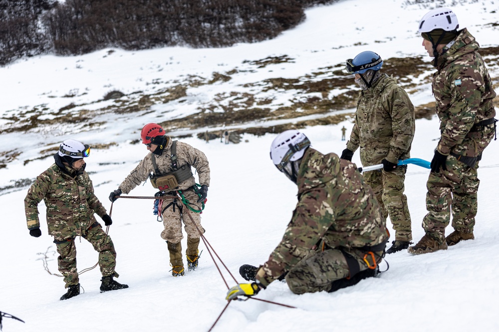 U.S. Marine Corps Mountain Warfare Instructors conduct cold-weather rescue training with Argentine marines