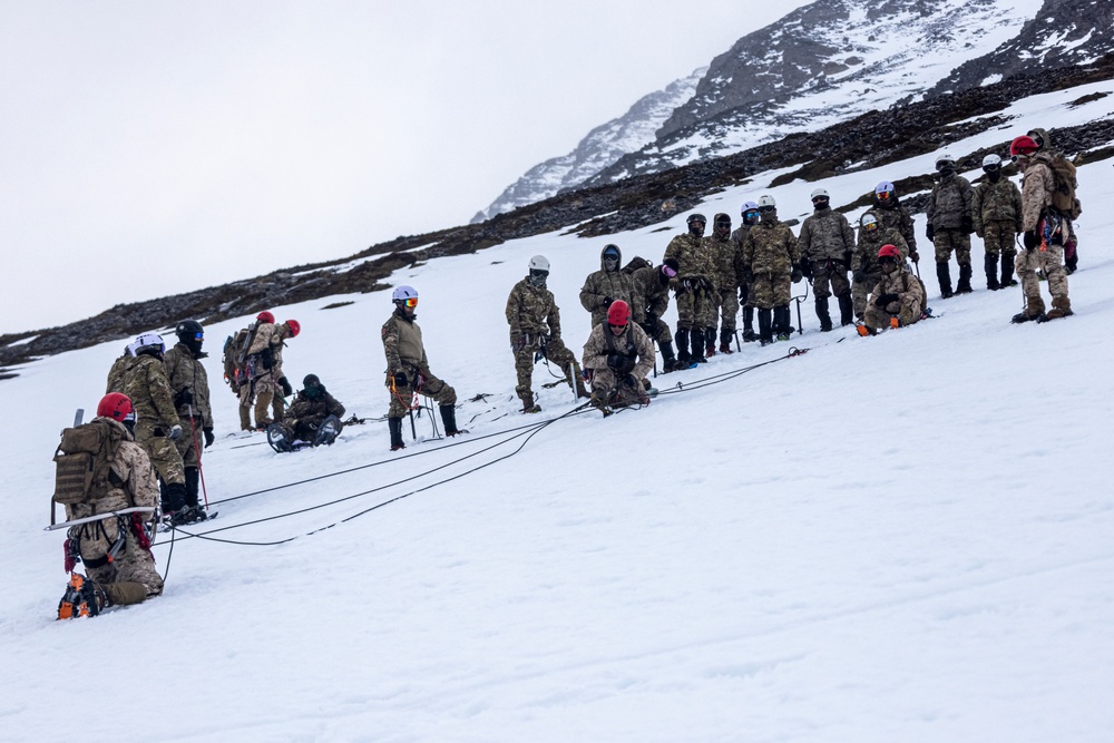 U.S. Marine Corps Mountain Warfare Instructors conduct cold-weather rescue training with Argentine marines