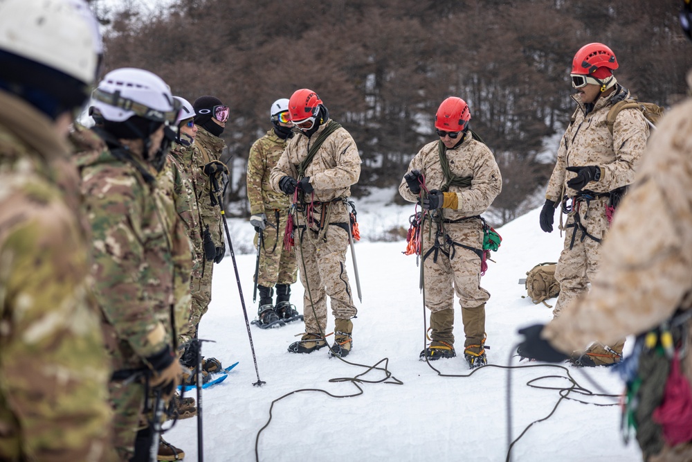 U.S. Marine Corps Mountain Warfare Instructors conduct cold-weather rescue training with Argentine marines