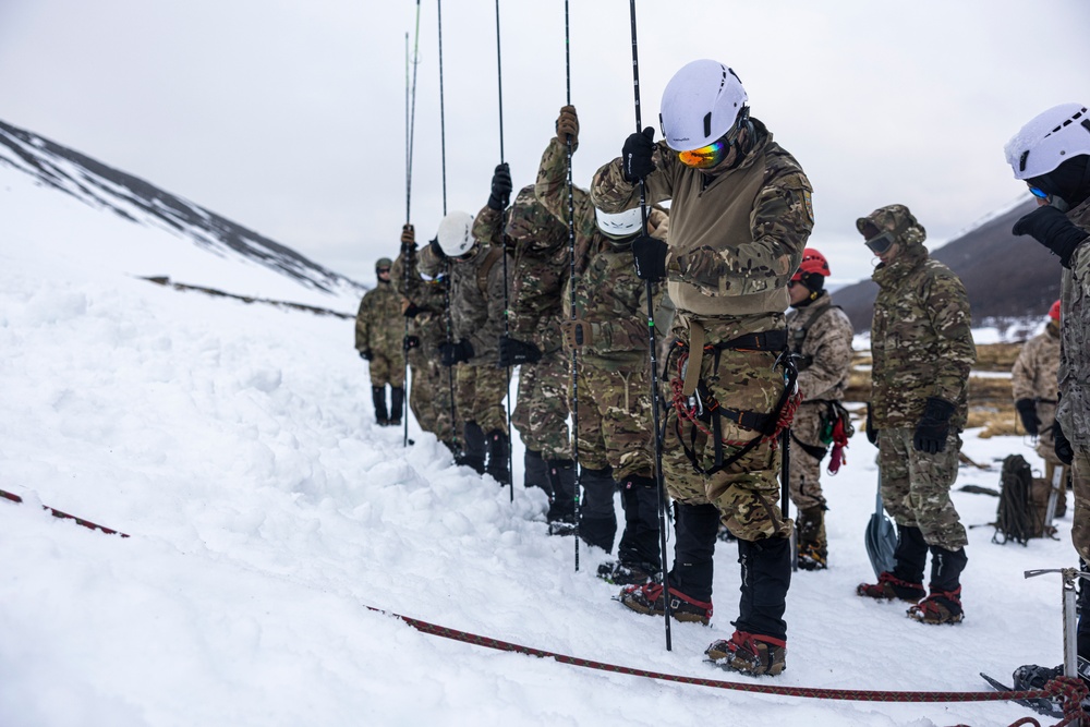 U.S. Marine Corps Mountain Warfare Instructors conduct cold-weather rescue training with Argentine marines