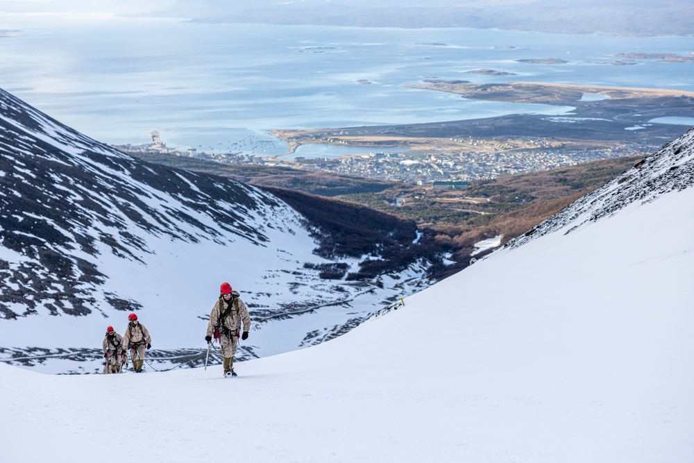 U.S. Marine Corps Mountain Warfare Instructors climbs toward mountain summit with Argentine marines