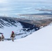 U.S. Marine Corps Mountain Warfare Instructors climbs toward mountain summit with Argentine marines