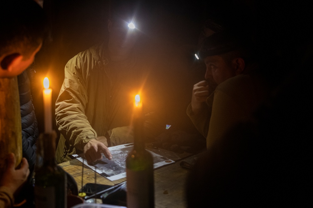 U.S. Marine Corps Mountain Warfare Instructors climbs toward mountain summit with Argentine marines