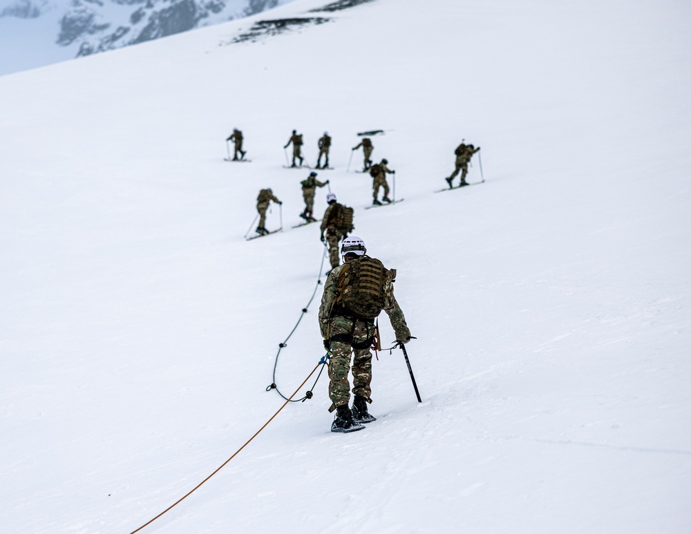 U.S. Marine Corps Mountain Warfare Instructors climbs toward mountain summit with Argentine marines