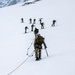 U.S. Marine Corps Mountain Warfare Instructors climbs toward mountain summit with Argentine marines