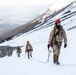 U.S. Marine Corps Mountain Warfare Instructors climbs toward mountain summit with Argentine marines