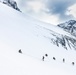 U.S. Marine Corps Mountain Warfare Instructors climbs toward mountain summit with Argentine marines