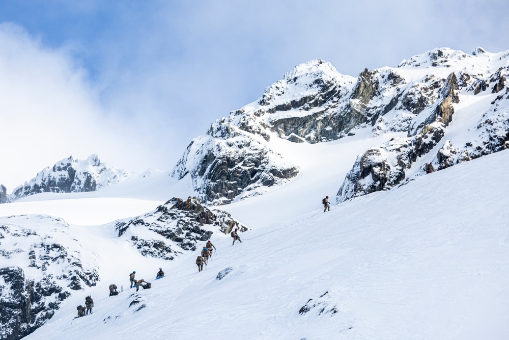 U.S. Marine Corps Mountain Warfare Instructors climbs toward mountain summit with Argentine marines