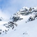 U.S. Marine Corps Mountain Warfare Instructors climbs toward mountain summit with Argentine marines