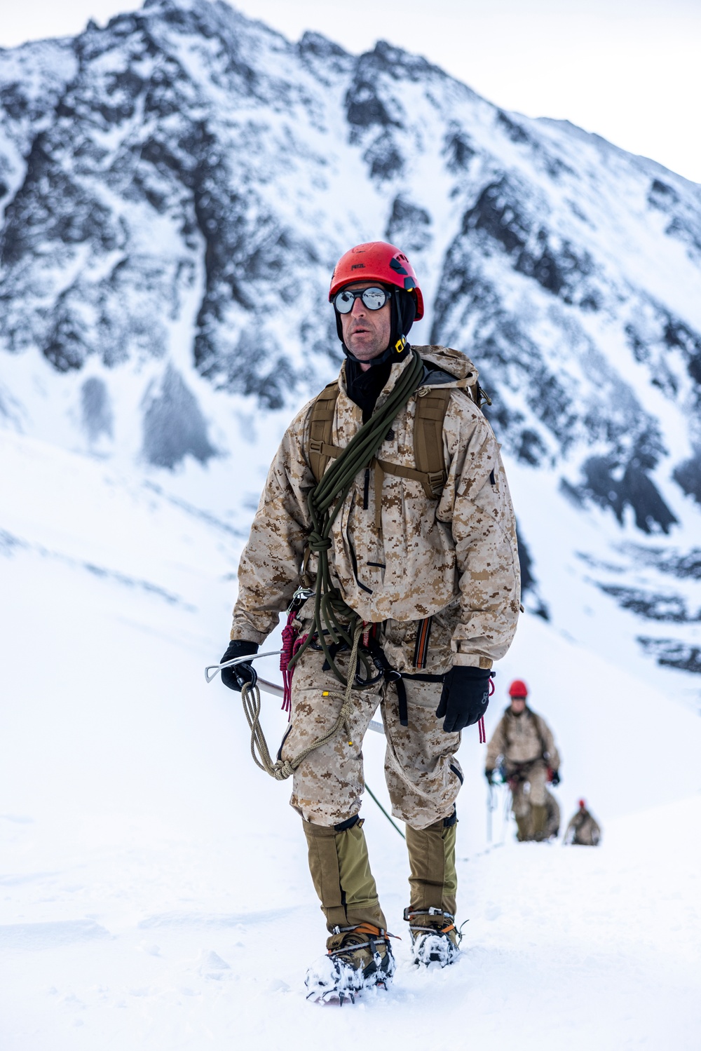 U.S. Marine Corps Mountain Warfare Instructors climbs toward mountain summit with Argentine marines