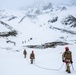 U.S. Marine Corps Mountain Warfare Instructors climbs toward mountain summit with Argentine marines