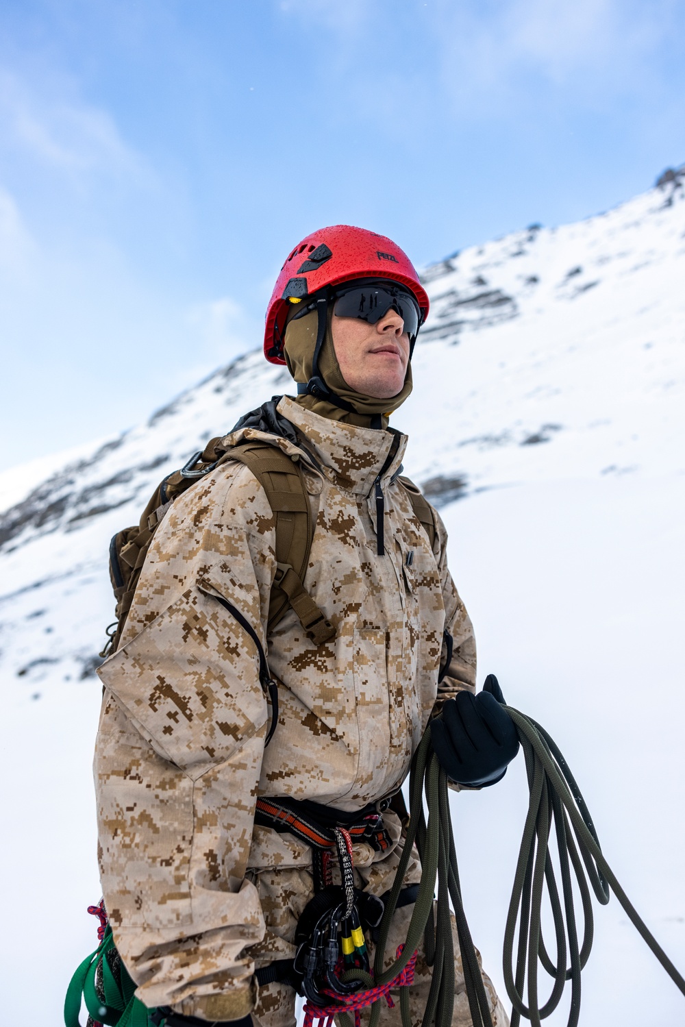 U.S. Marine Corps Mountain Warfare Instructors climbs toward mountain summit with Argentine marines