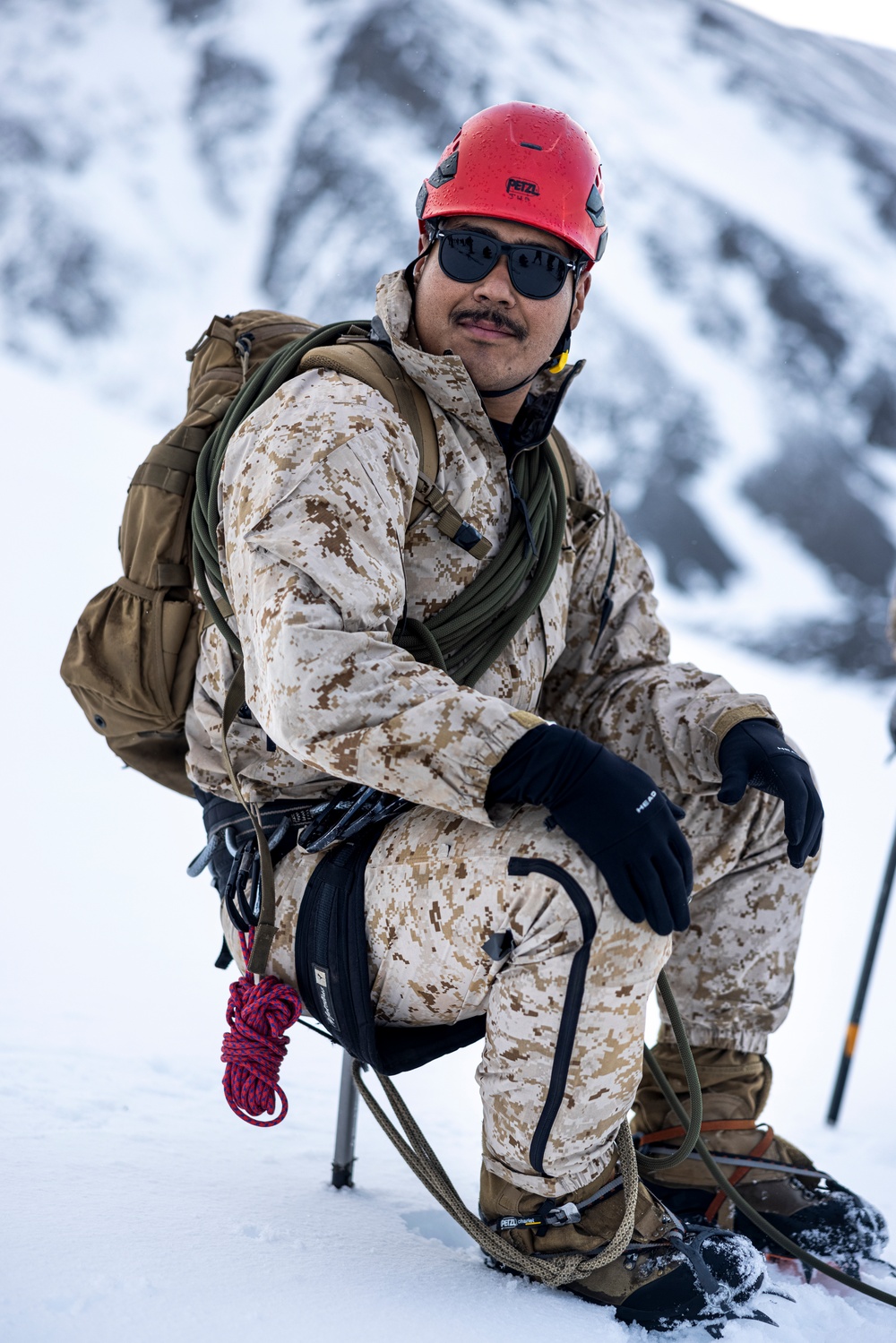 U.S. Marine Corps Mountain Warfare Instructors climbs toward mountain summit with Argentine marines