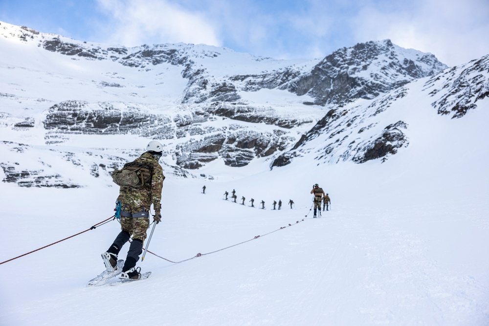 U.S. Marine Corps Mountain Warfare Instructors climbs toward mountain summit with Argentine marines