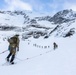 U.S. Marine Corps Mountain Warfare Instructors climbs toward mountain summit with Argentine marines