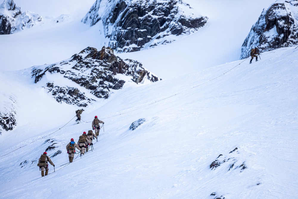 U.S. Marine Corps Mountain Warfare Instructors climbs toward mountain summit with Argentine marines