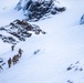 U.S. Marine Corps Mountain Warfare Instructors climbs toward mountain summit with Argentine marines