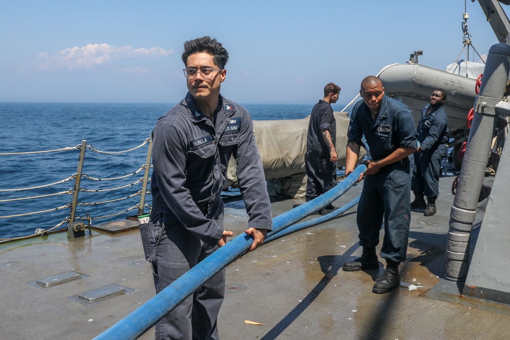 Sailors aboard the USS Howard conduct a freshwater washdown in Sagami Wan