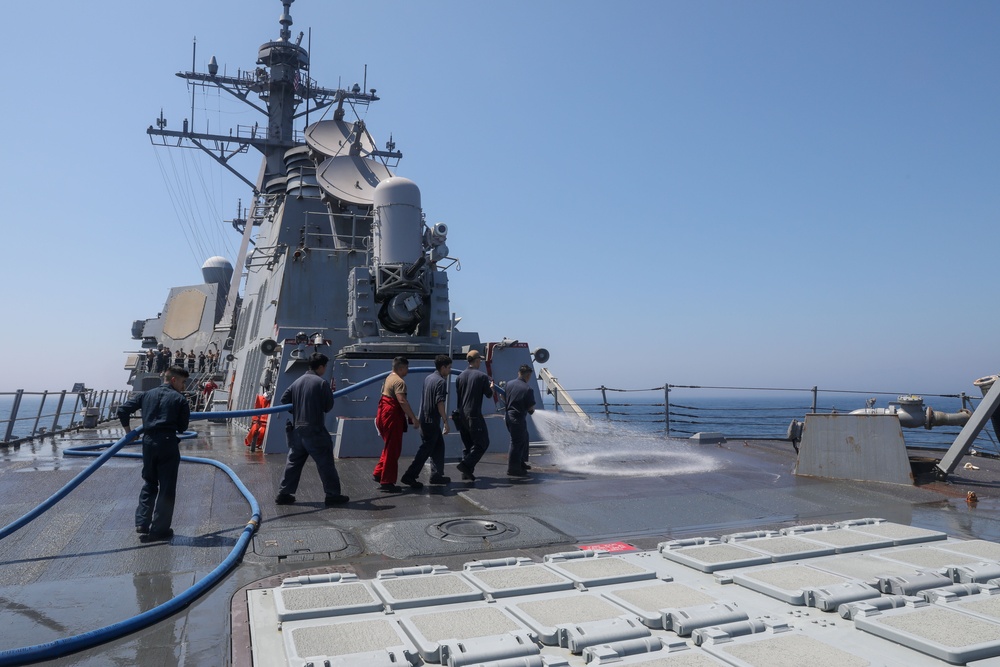 Sailors aboard the USS Howard conduct a freshwater washdown in Sagami Wan